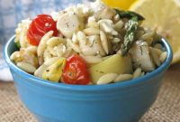 Pan-Seared Scallops over Warm Orzo with Marinated Artichokes and Feta