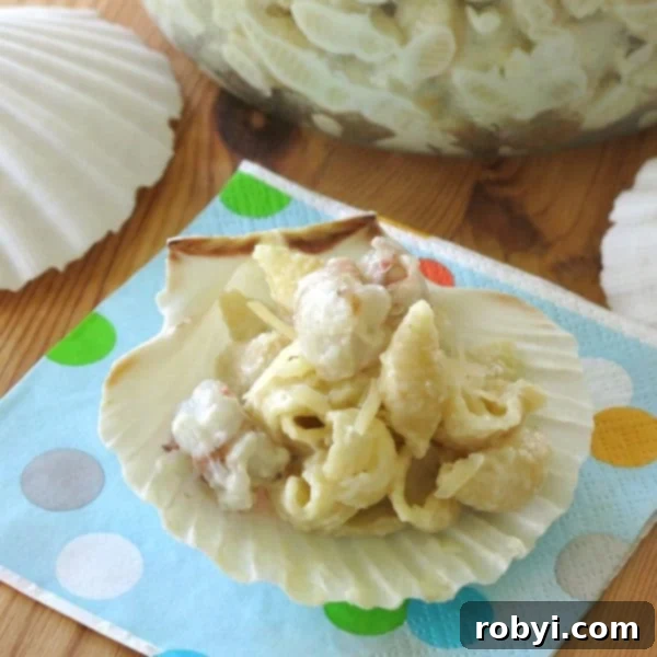 Elevated Shrimp Mac and Cheese 5 Fancy Gourmet Mac and Cheese with Shrimp presented elegantly on a clam shell