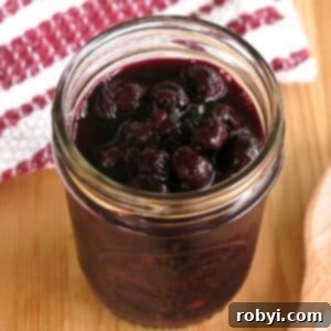 Easy blueberry compote in a mason jar.