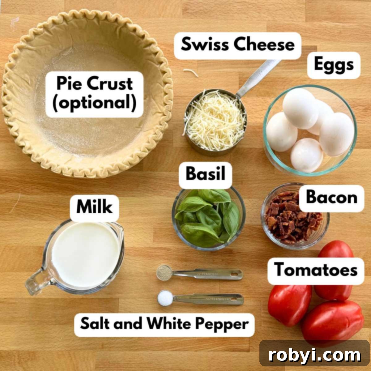A well-arranged collage of fresh ingredients needed for the quiche: eggs, milk, shredded Swiss cheese, fresh basil leaves, crumbled cooked bacon, three ripe Roma tomatoes, a pie crust, and salt and white pepper.
