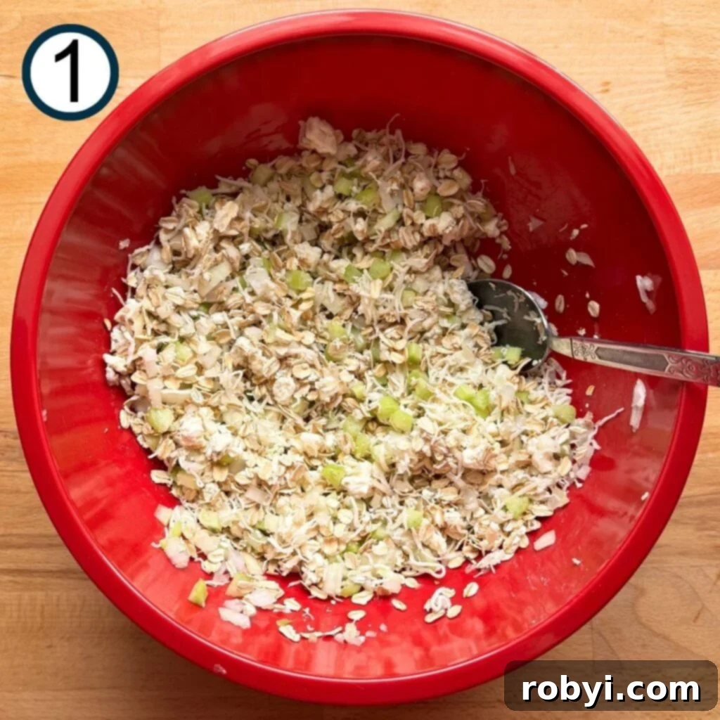 Oatmeal, mozzarella cheese, blue cheese, celery, and onion mixed together in a large bowl.