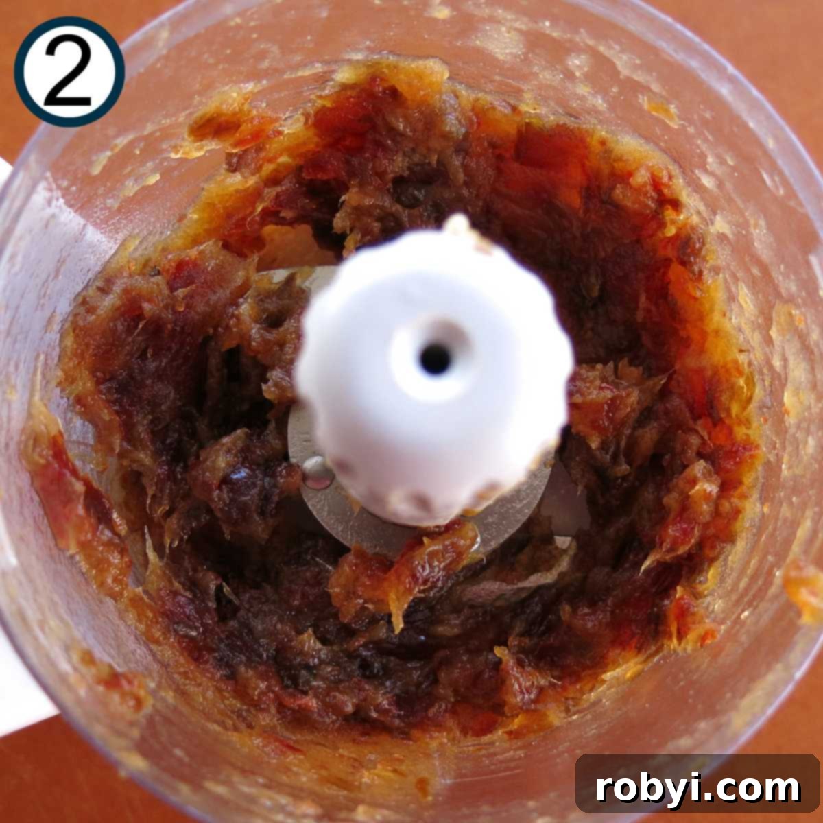 Pureed Medjool dates in the base of a food processor.