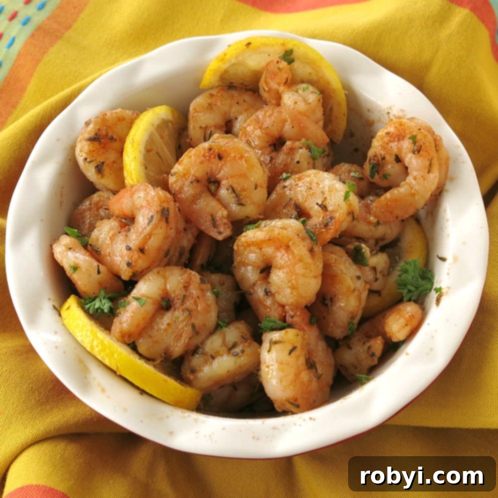 Fiery Cajun Shrimp Guac Scoops 3 Perfectly cooked blackened Cajun shrimp in a rustic bowl, ready for assembly.