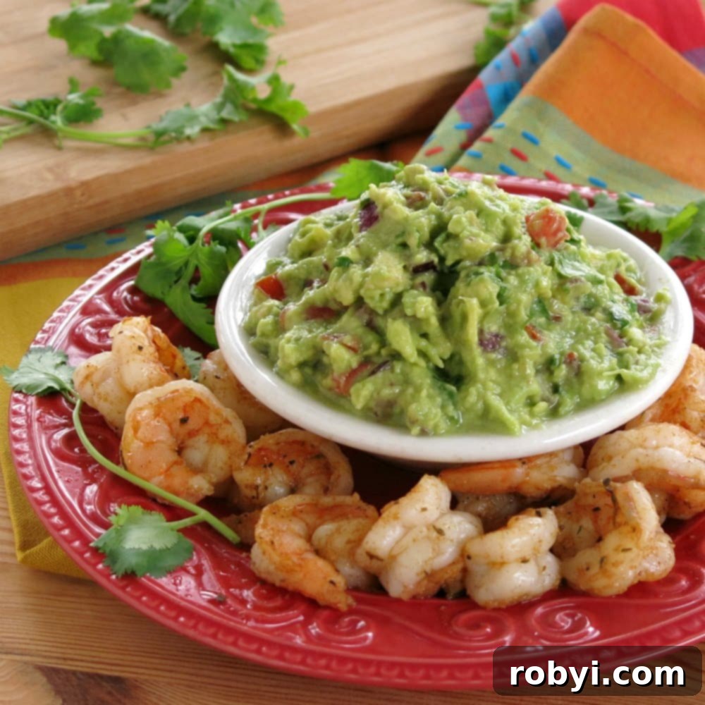 Fiery Cajun Shrimp Guac Scoops 4 Creamy, fresh guacamole surrounded by succulent blackened shrimp, ready to be assembled into bites.
