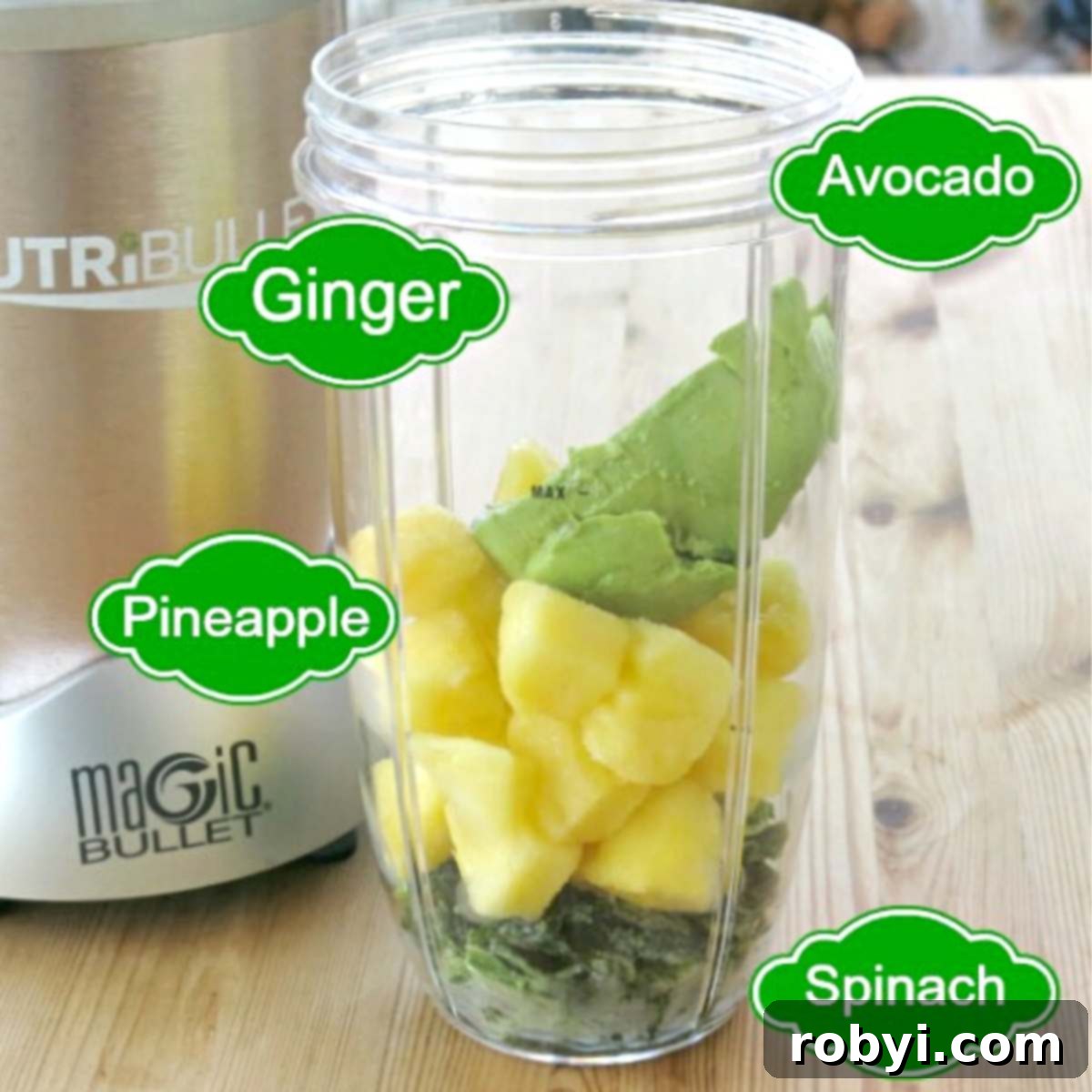 Creamy Green Tropical Elixir 3 Ingredients in a Nutribullet cup: Pineapple, avocado, spinach, and ginger.
