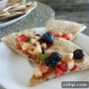 Apple Berry Salsa on 3 cinnamon chips on a plate.