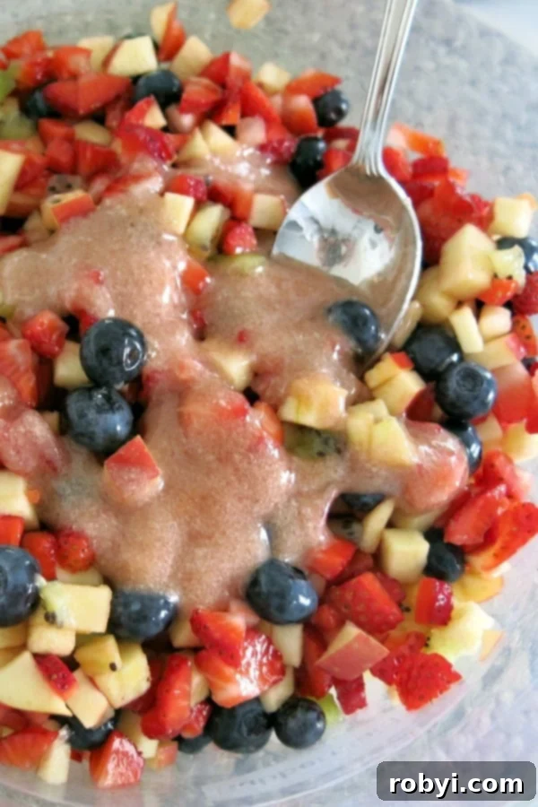 Fruit salsa in bowl with jam and stevia glaze drizzled on top.