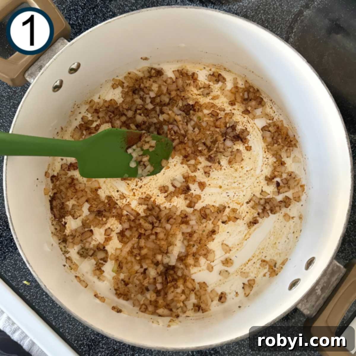 Green spatula sautéing diced onions, minced garlic, dried oregano, and chili powder in a large stock pot.