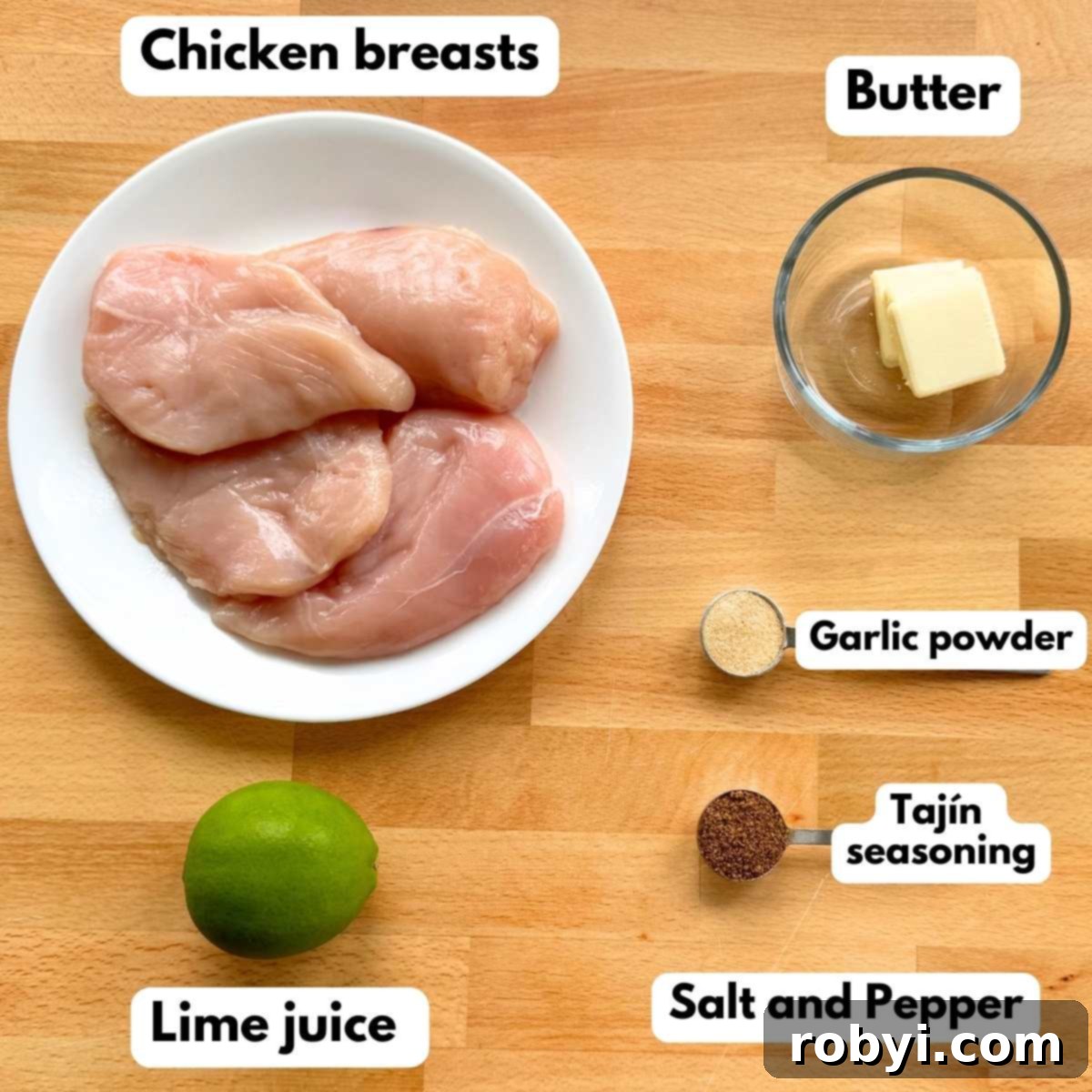 Ingredients to make recipe: 4 chicken breasts on a plate, 4 tabs of butter in a glass bowl, a lime, and garlic powder and Tajin seasoning on measuring spoons.