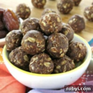 Effortless Vegan Chocolate Date Truffles 6 Chocolate Date Balls in a bowl.