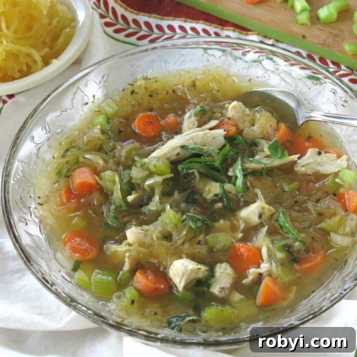Spaghetti squash soup with chicken in a bowl.