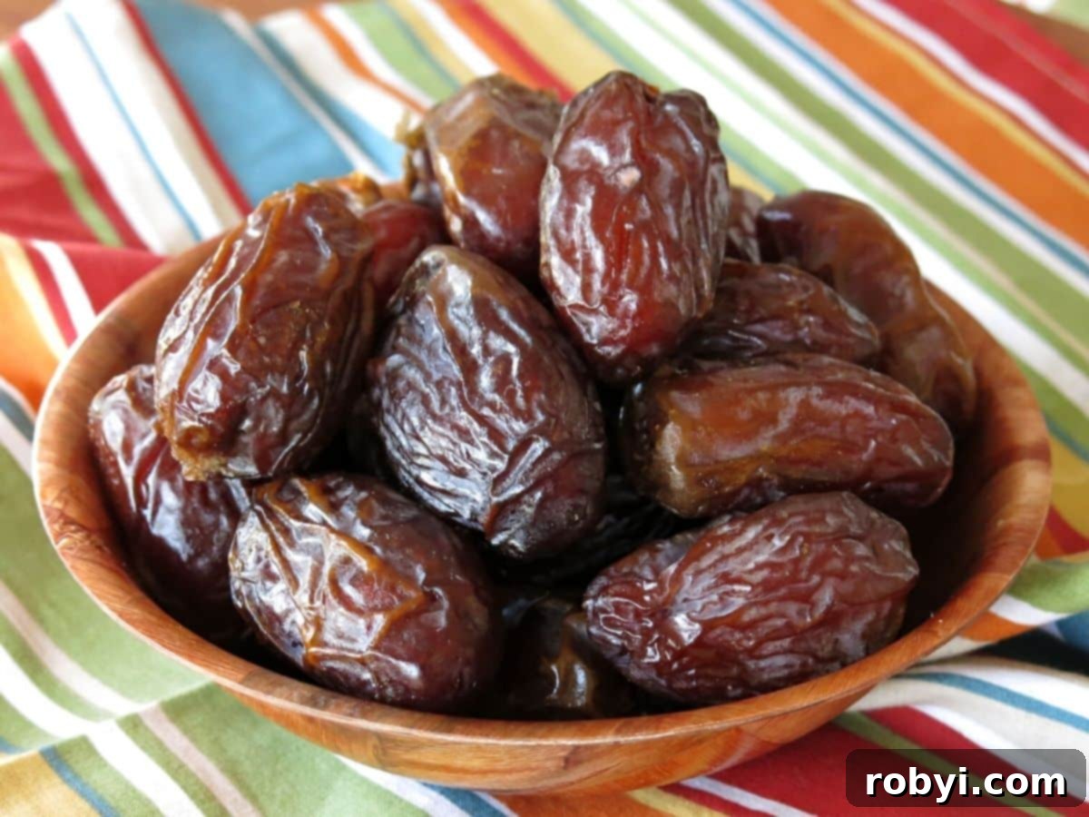 Bowl of Medjool Dates on a cloth napkin.