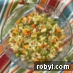 Cauliflower rice pilaf with vegetables in a bowl.C