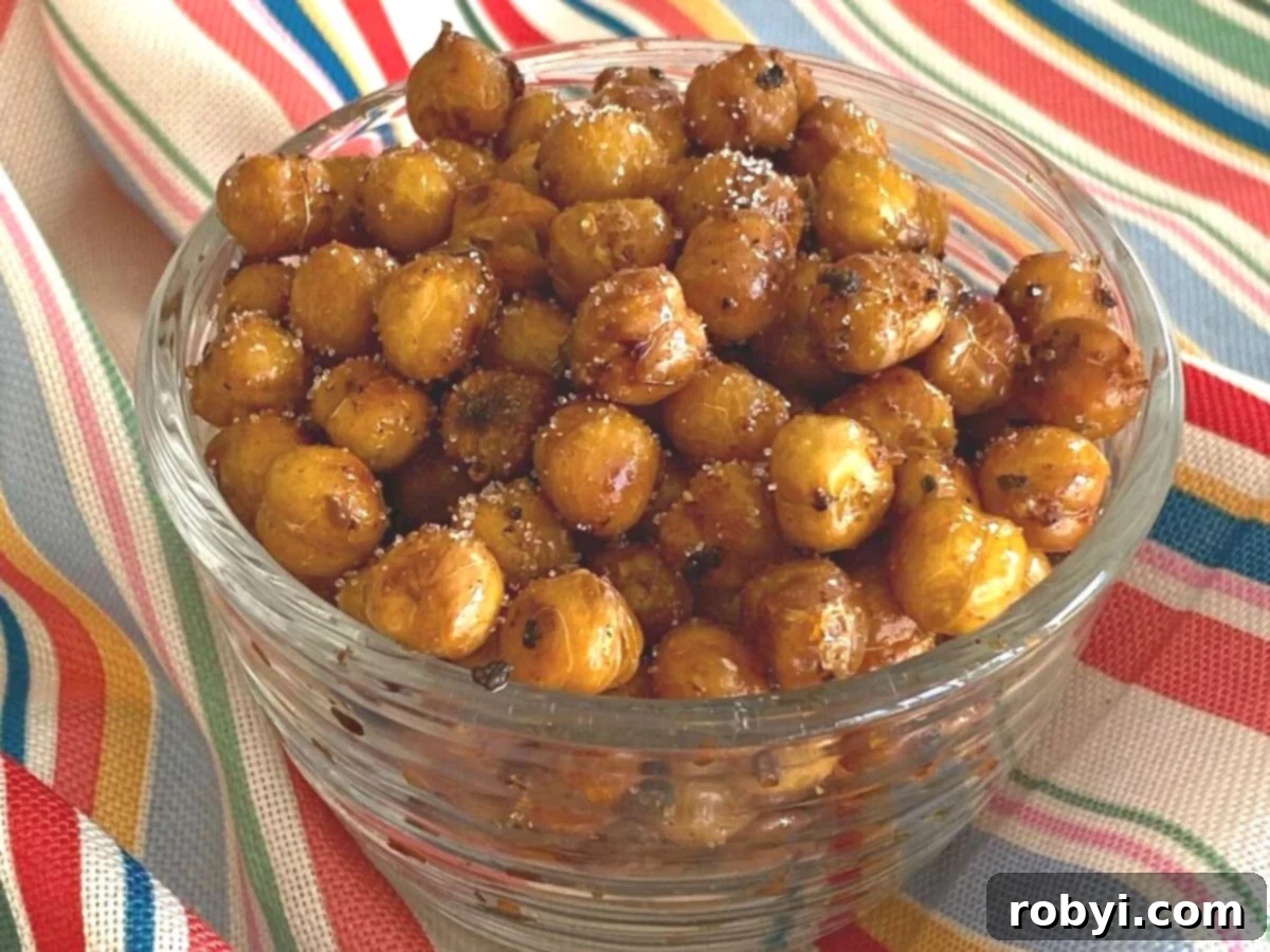 Sweet and spicy chickpeas in a glass serving dish.