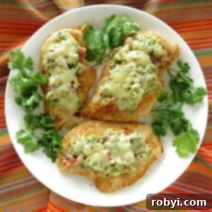 Guacamole chicken melts on a plate surrounded by cilantro