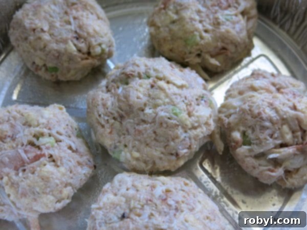 Formed Crab Cakes in an aluminum tin Ready to Cook