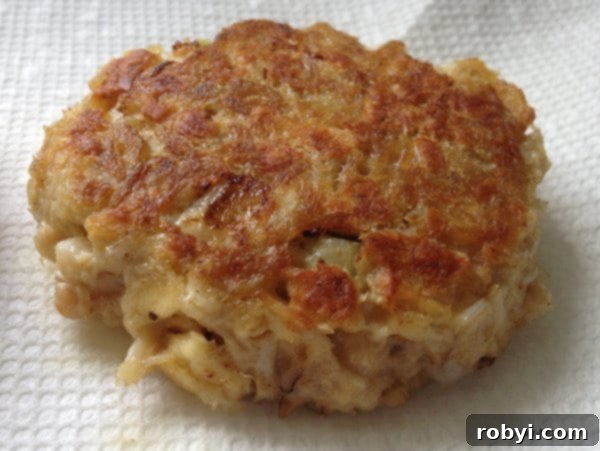 Crab Cake cooked on stove-top on a paper towel to drain.