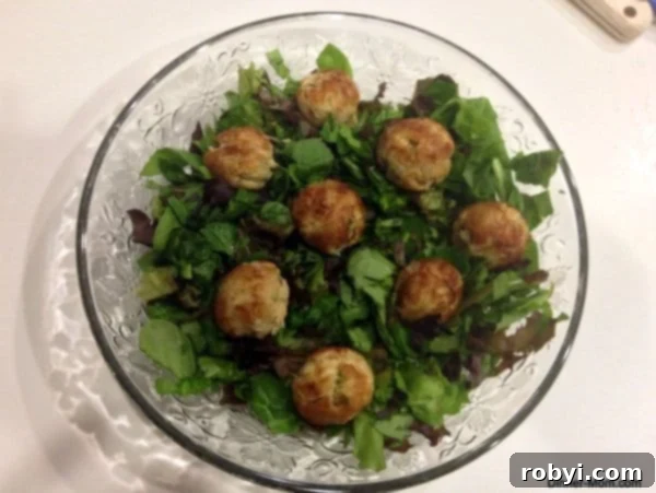 Beyond Cake Pops: 3 Unexpected Maker Ideas 3 Mini crab cake bites cooked in a cake pop maker, arranged on lettuce on a glass plate