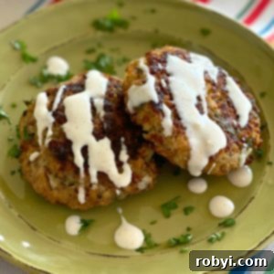 Baked Salmon Cakes: Two Ways (Patties or Muffin Tin) 5 Two baked salmon cakes on a plate.