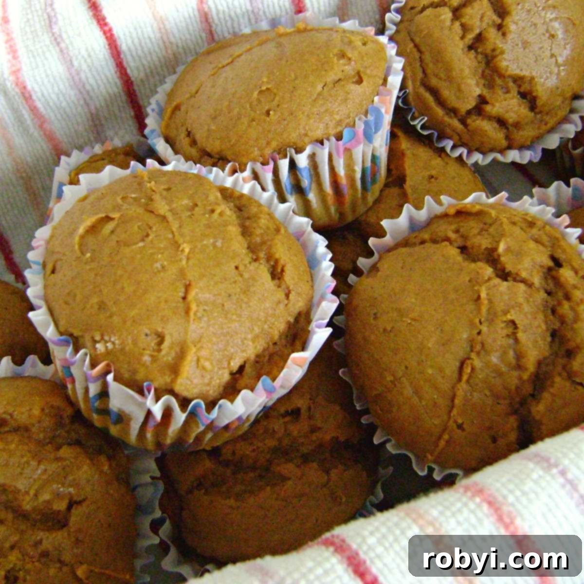 A basket filled with freshly baked 2-ingredient pumpkin muffins, showcasing their soft and inviting texture.