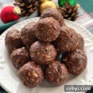 Plate of chocolate bliss balls made with hot honey, almond butter and chia seeds.