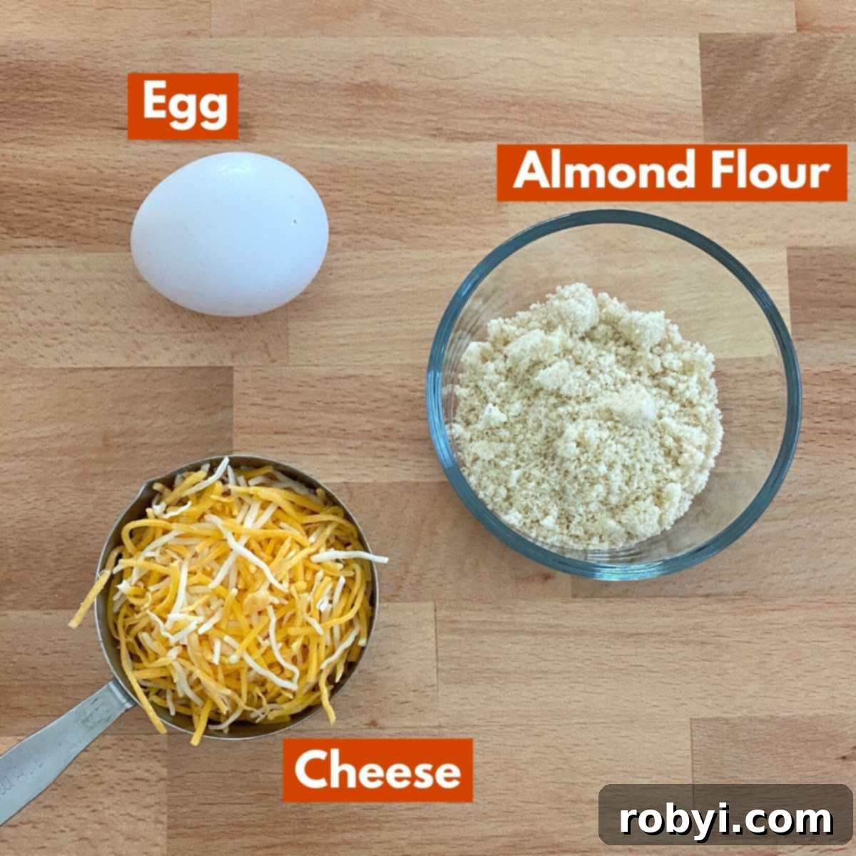 Labeled graphic of ingredients to make keto chaffle recipe: egg, cheese and almond flour.