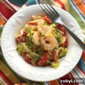Creamy Baked Feta Shrimp with Zucchini Noodles 6 Viral Tik Tok Baked Feta Zoodles and Shrimp in a bowl with a fork.