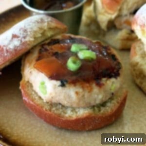 Mango Chutney Turkey Burger in a bun on a plate.