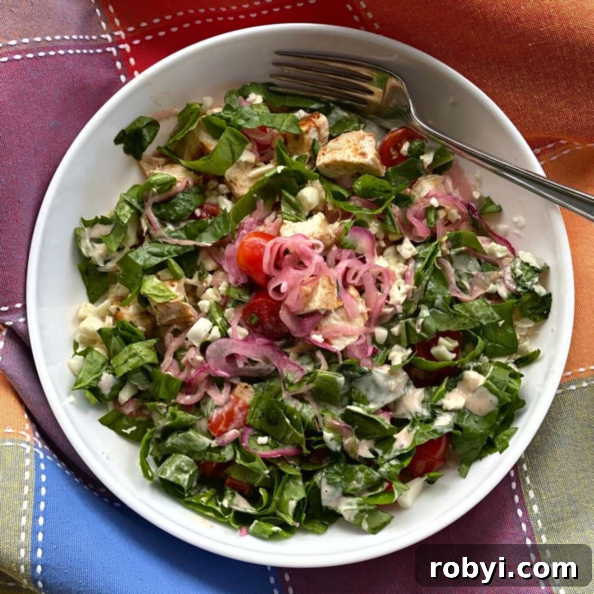 A vibrant Chicken Shawarma Bowl generously topped with quick pickled pink onions.