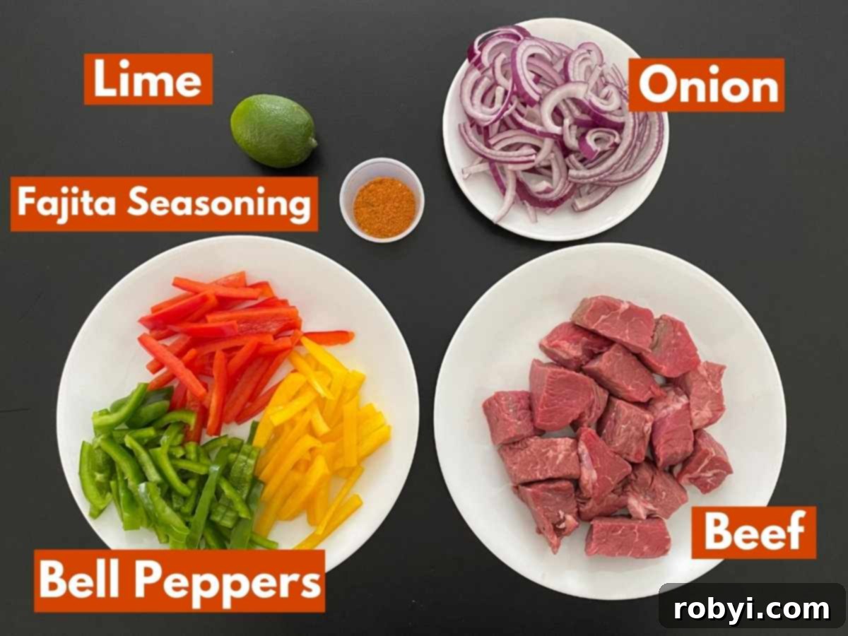 Labeled ingredients to make recipe: beef cubes, lime, onion, plate with yellow, green, and red bell peppers, and fajita seasoning in a cup.