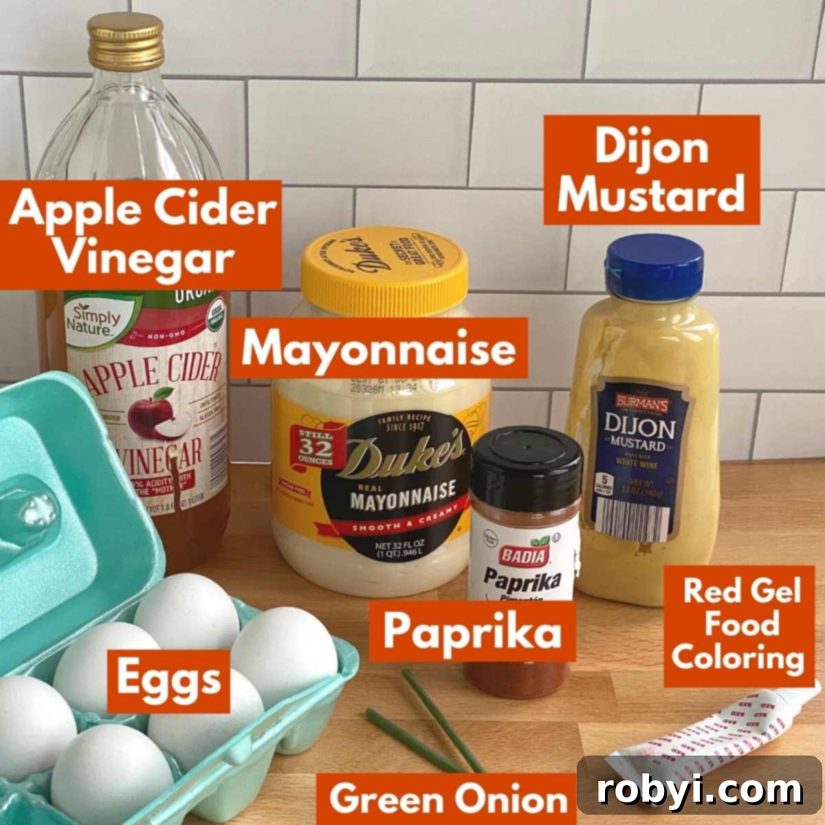 Labeled ingredients for making pumpkin deviled eggs.