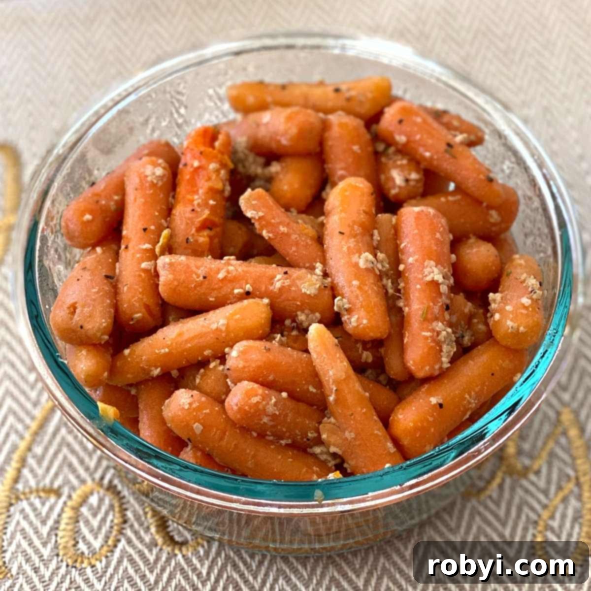 Garlic sauteéd baby carrots in a serving dish.