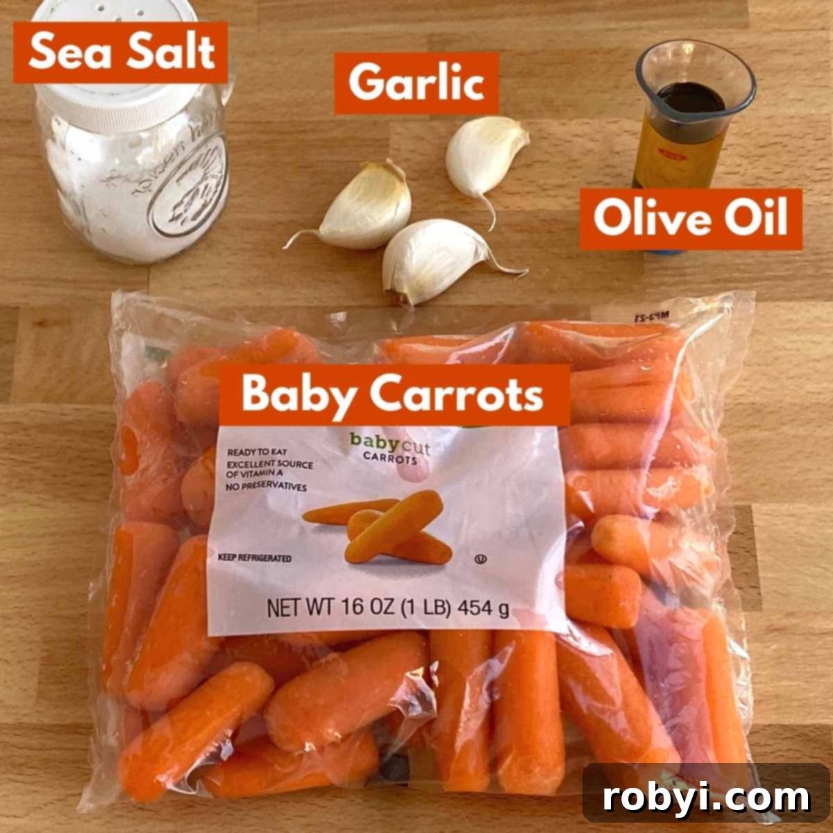 Ingredients to make the recipe: bag of baby carrots, garlic cloves, salt, and olive oil.