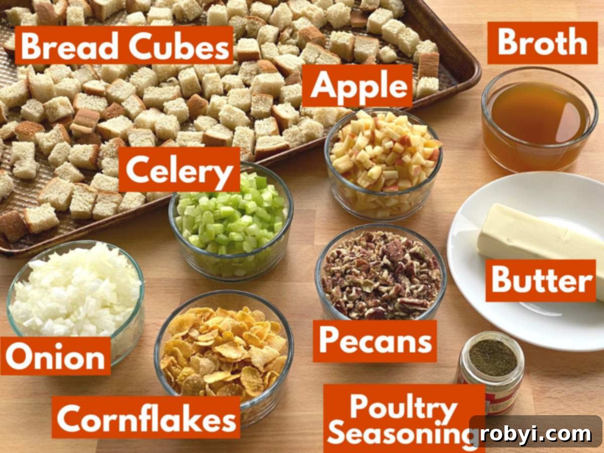 Prep-Ahead Oven Stuffing 3 A curated selection of labeled ingredients, including fresh bread, apples, celery, onion, pecans, cornflakes, butter, poultry seasoning, and broth, laid out for making the best homemade stuffing.
