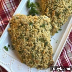 Fancy herb crusted turkey tenderloin on a platter, sliced and ready to serve.