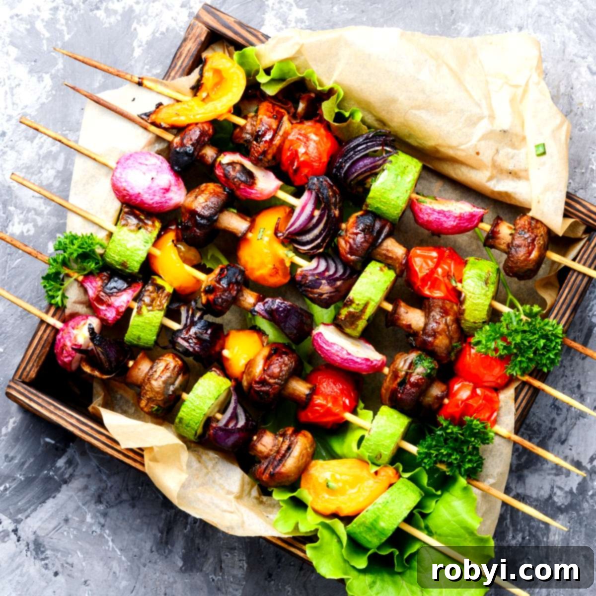 Six skewers laden with colorful grilled vegetables, including tomatoes, zucchini, radishes, mushrooms, and peppers.