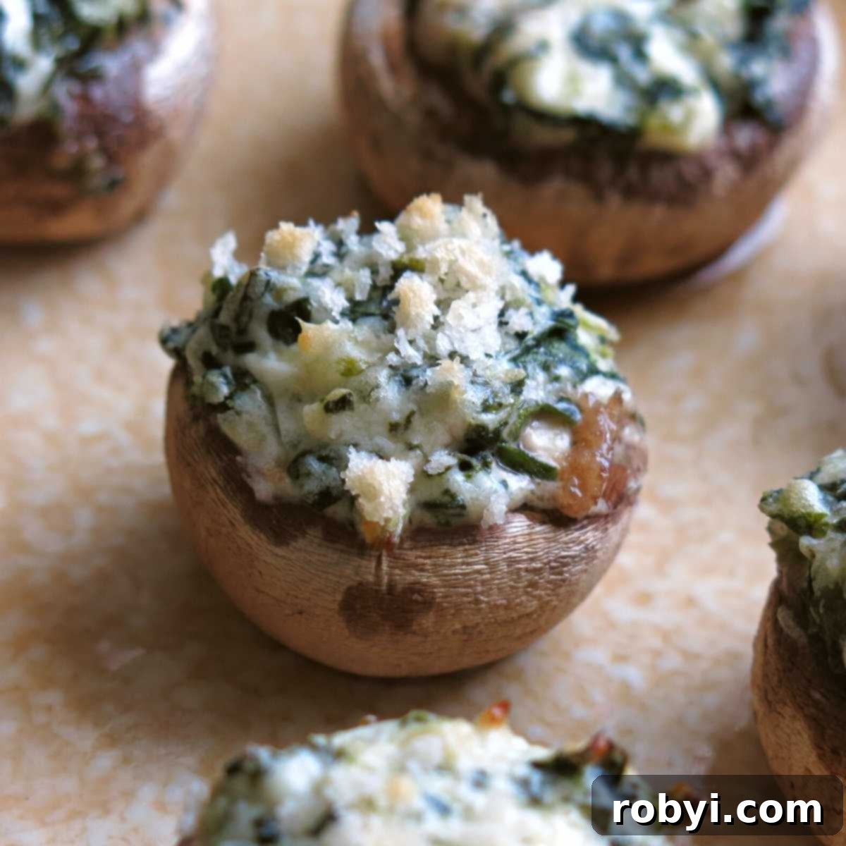 A beautifully arranged platter of easy stuffed mushrooms with cream cheese and spinach, ready to be served.