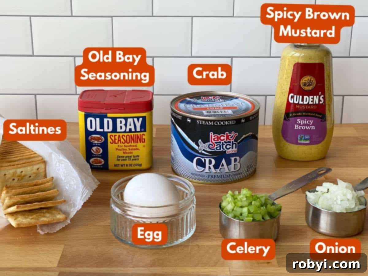 Ingredients to make crab balls: can of lump crab, Old Bay seasoning, spicy brown mustard, saltines, egg, celery, onion.