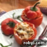 2 Chicken Meatloaf Stuffed Peppers on a plate with a fork.