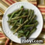 Crispy Roasted Green Beans on a plate.