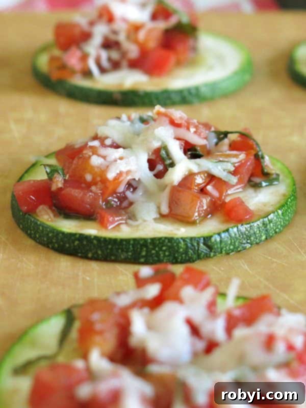 Upclose zucchini bruschetta on cutting board.