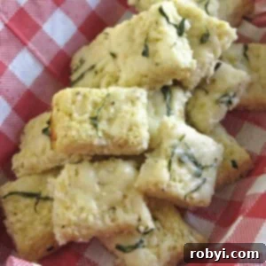Healthy Cauliflower Pizza: Bites or Crispy Crust 10 Cauliflower Pizza Bites in a basket lined with a red and white checkered napkin, garnished with fresh basil.