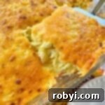 Host a Friendsgiving Feast for Less 9 A serving of spaghetti squash au gratin being lifted out of a casserole dish.