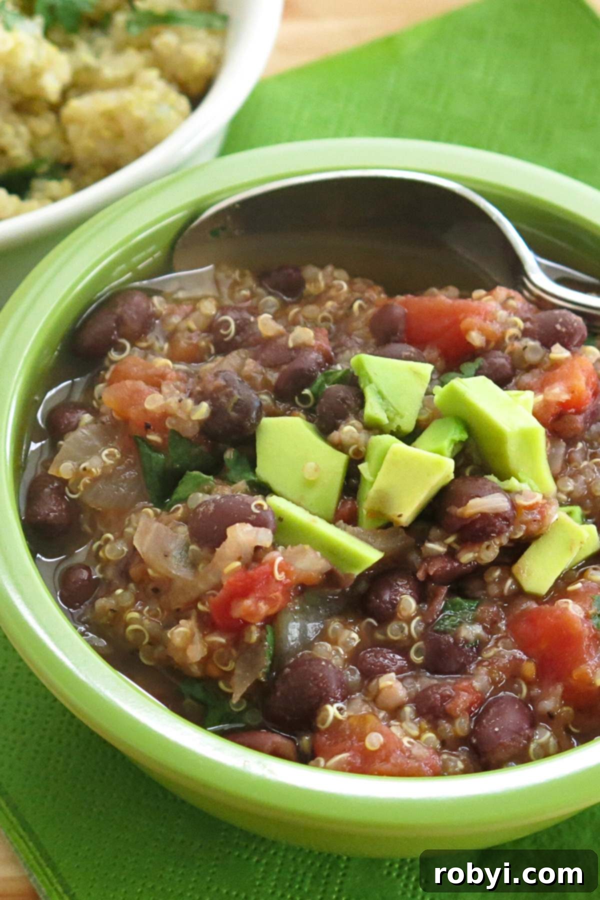 Quick & Hearty Black Bean Quinoa Soup 2 A steaming bowl of Black Bean Quinoa Soup, garnished with fresh cilantro, ready to be enjoyed.