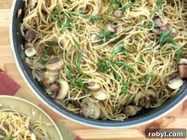 Skillet with mushroom olive oil pasta