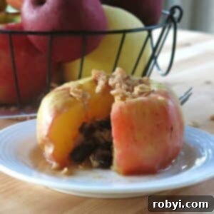 Warm Apples in Minutes 7 Easy microwave baked apple on a plate, garnished with topping.