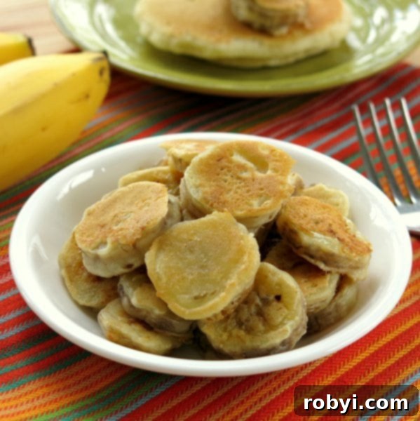 Sweet Fluffy Banana Pancakes 4 A bowl filled with freshly dipped banana medallions in pancake batter.