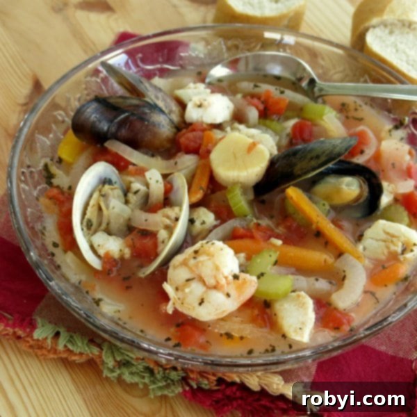 Italian Seafood Soup in bowl with spoon.