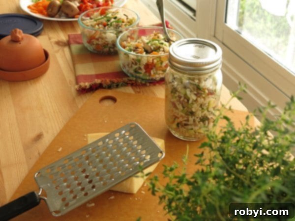 Work table with vegetable rice pilaf portioned into containers.