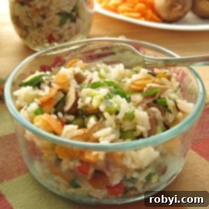 Vegetable Rice Pilaf Recipe in glass bowl with fork